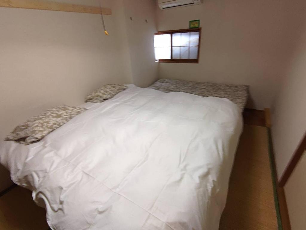 Postel nebo postele na pokoji v ubytování Hotel Tae Windsor