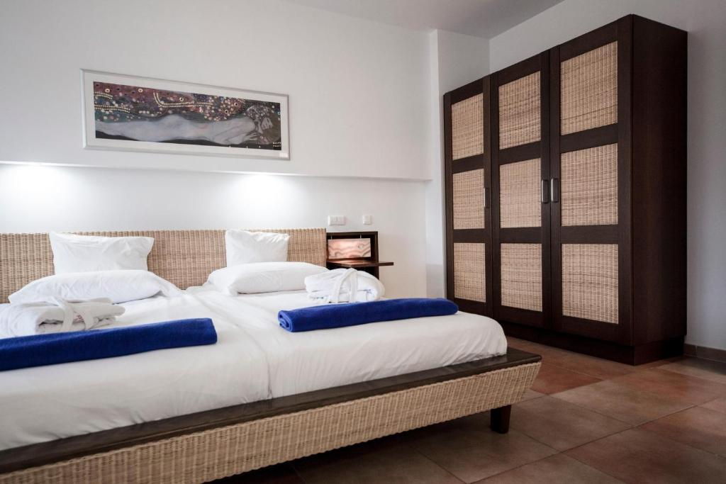 A bed or beds in a room at Playitas Villas - Sports Resort