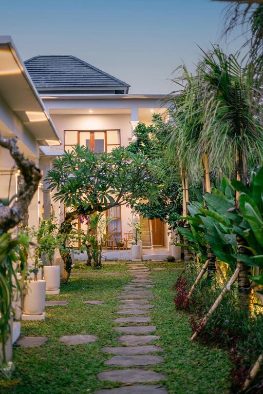 a pathway in front of a house at Kemuning Living Sanur in Sanur