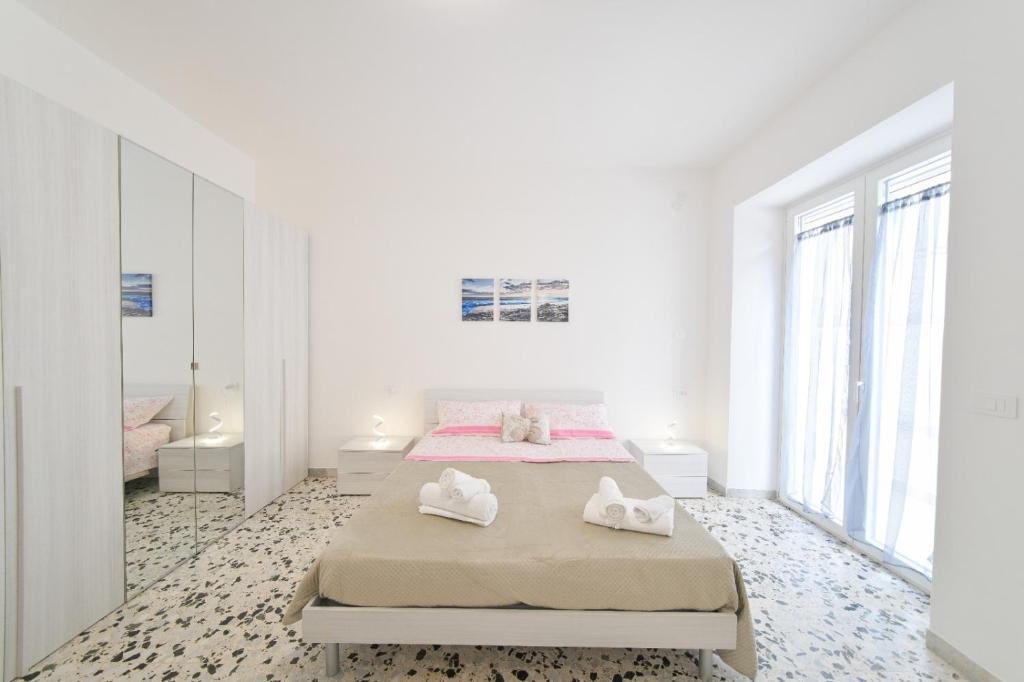 Postel nebo postele na pokoji v ubytování Casa Lulù - Appartamenti Ischia Centro