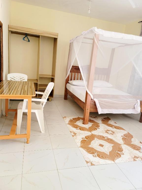 Postel nebo postele na pokoji v ubytování Casuarina Lounge