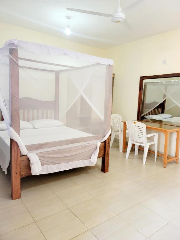 Postel nebo postele na pokoji v ubytování Casuarina Lounge