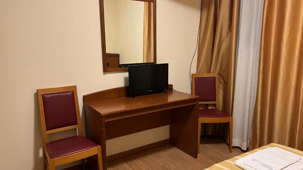 TV a/nebo společenská místnost v ubytování Ristorante Albergo Wada