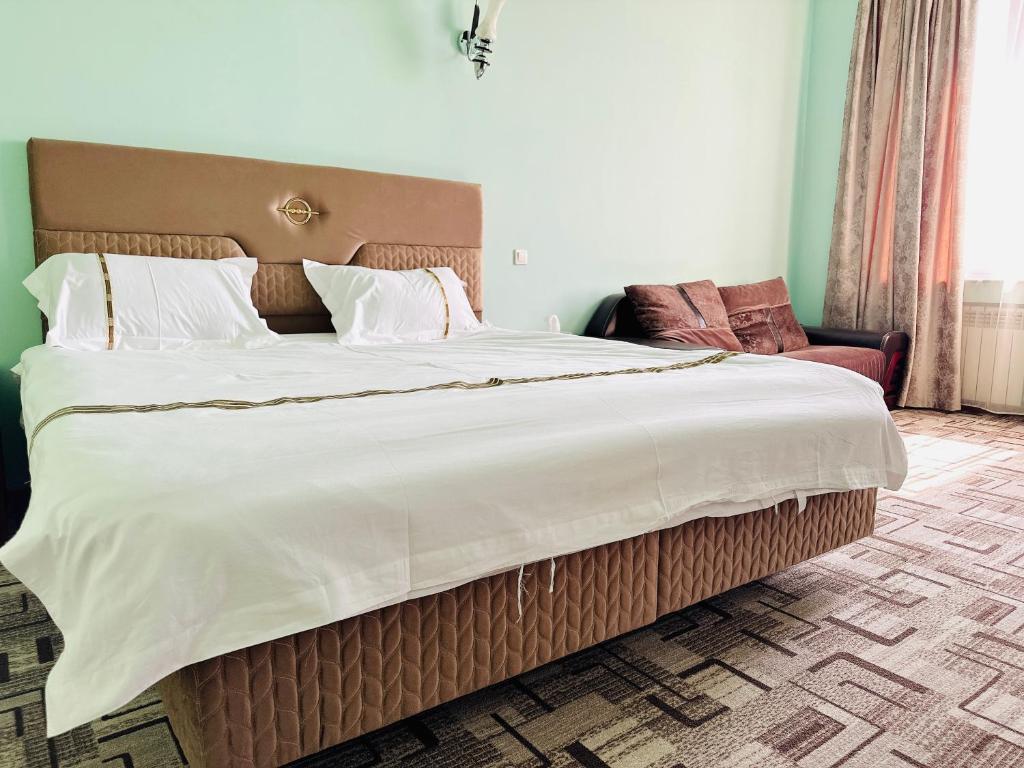 Postel nebo postele na pokoji v ubytování SD Hotel