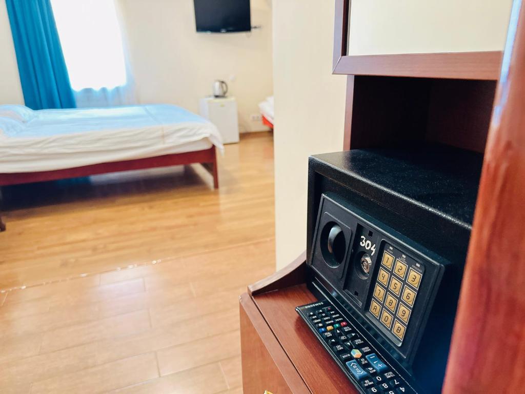 Postel nebo postele na pokoji v ubytování SD Hotel