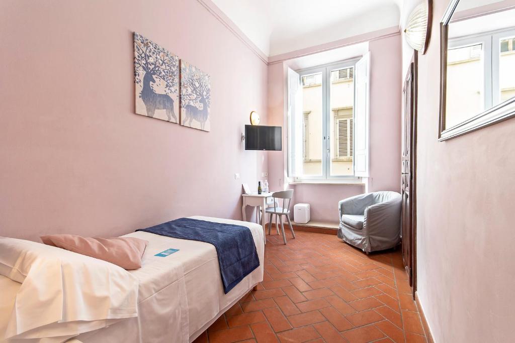 Postel nebo postele na pokoji v ubytování Hotel Costantini