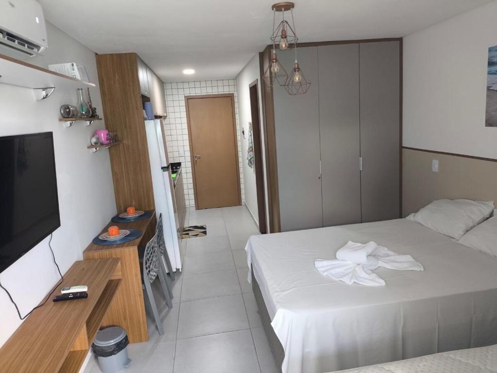 En eller flere senge i et værelse på Flat Porto Centro