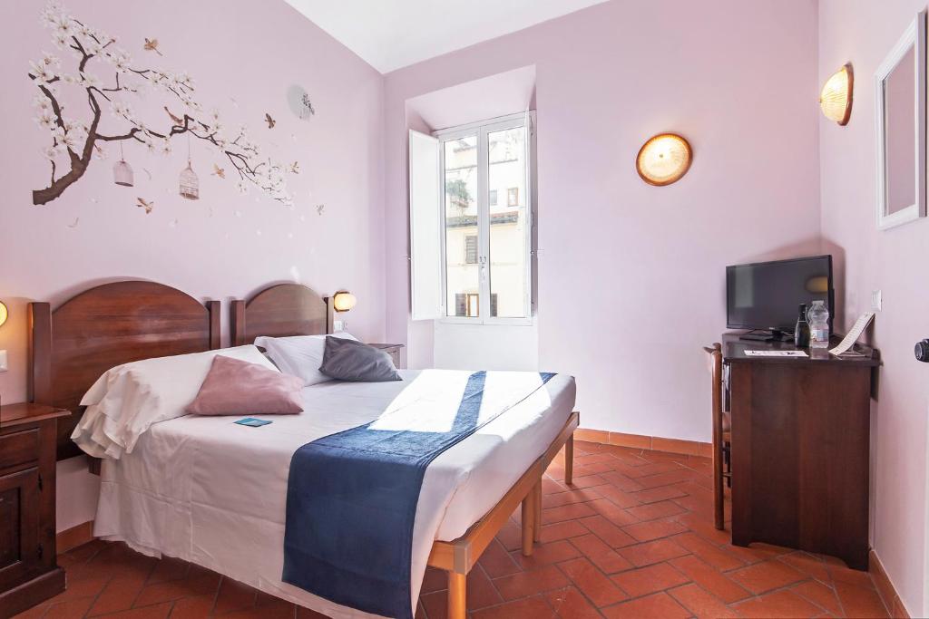 Postel nebo postele na pokoji v ubytování Hotel Costantini