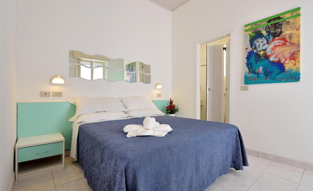 Postel nebo postele na pokoji v ubytování Hotel Oltremar B&B