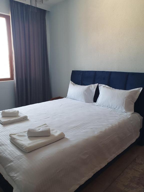 A bed or beds in a room at Didi House