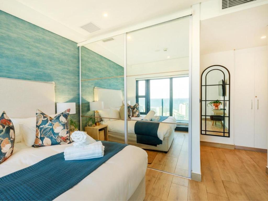Ένα ή περισσότερα κρεβάτια σε δωμάτιο στο Umhlanga Village Ocean Views