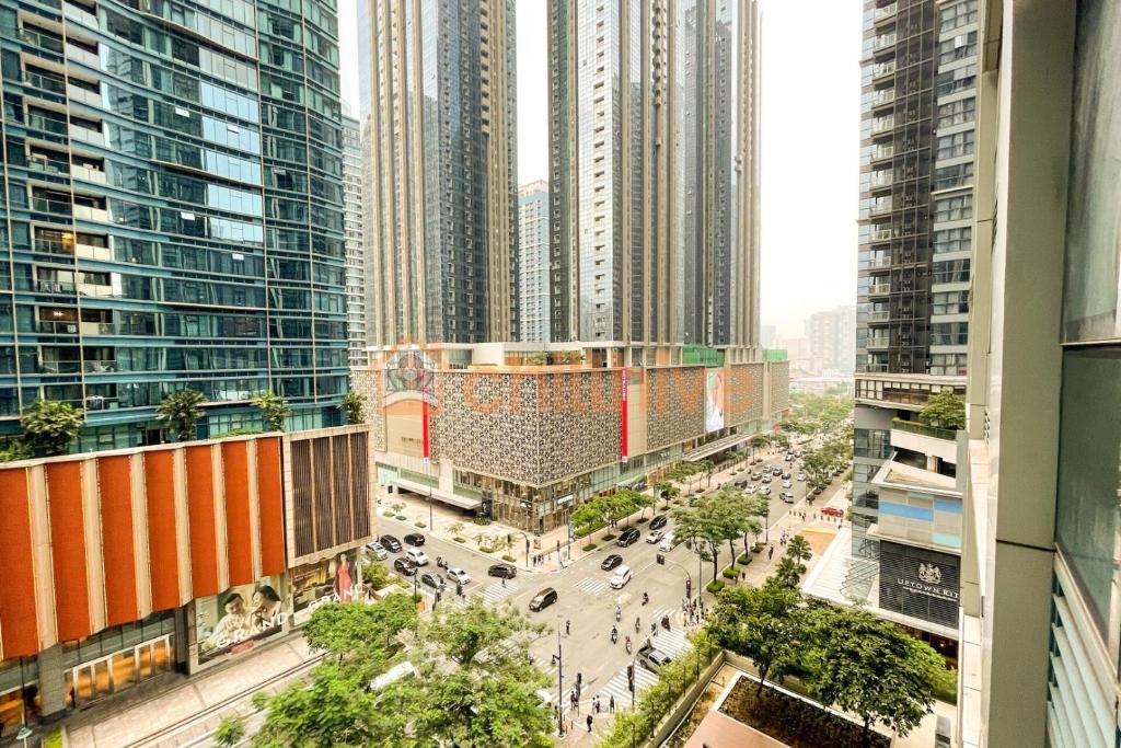 an aerial view of a city with tall buildings at Chic BGC Condo Across Uptown Mall #ournw9b in Manila