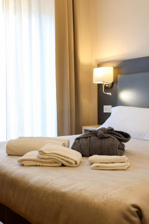 Postel nebo postele na pokoji v ubytování Hotel Victoria