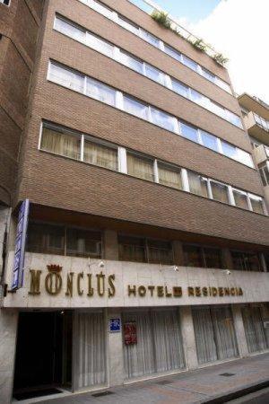 a building with a hotel sign in front of it at Monclús in Palencia