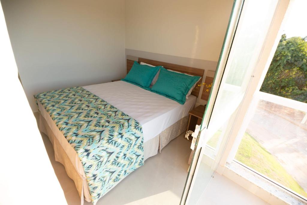 Cama ou camas em um quarto em Ilhas do Lago Eco Resort by WAM Experience
