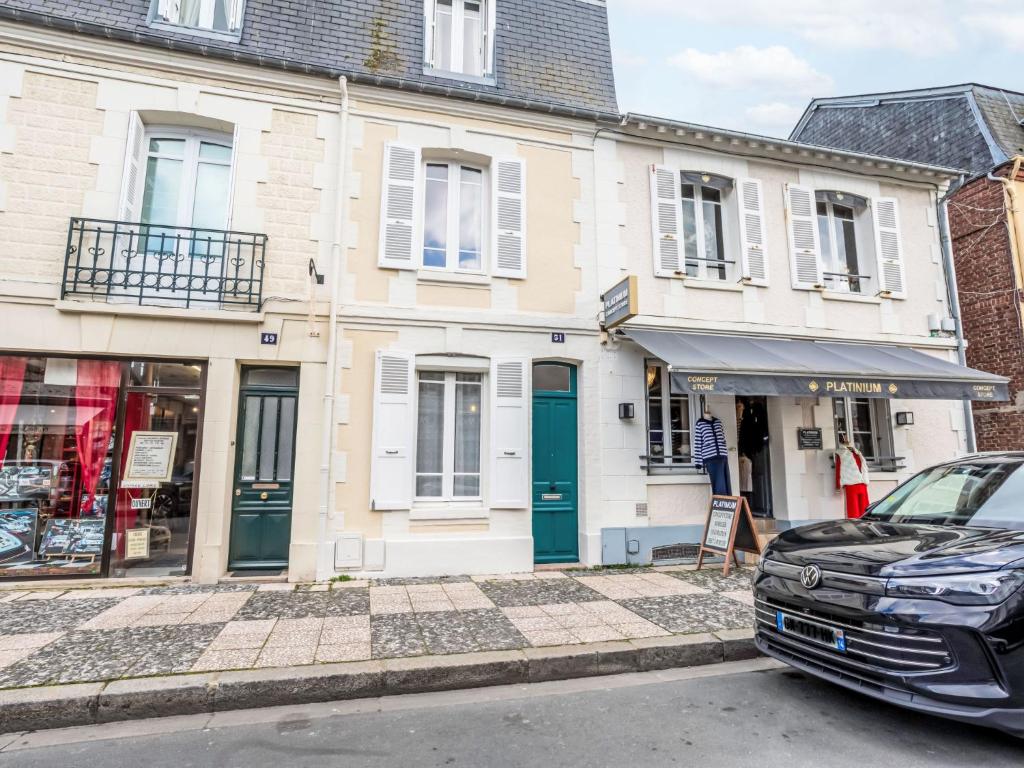 a car parked in front of a building at Holiday Home Gambetta by Interhome in Deauville