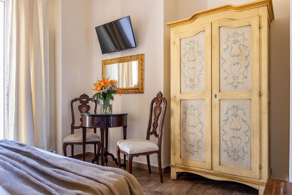 A bed or beds in a room at Pascià Cappuccini