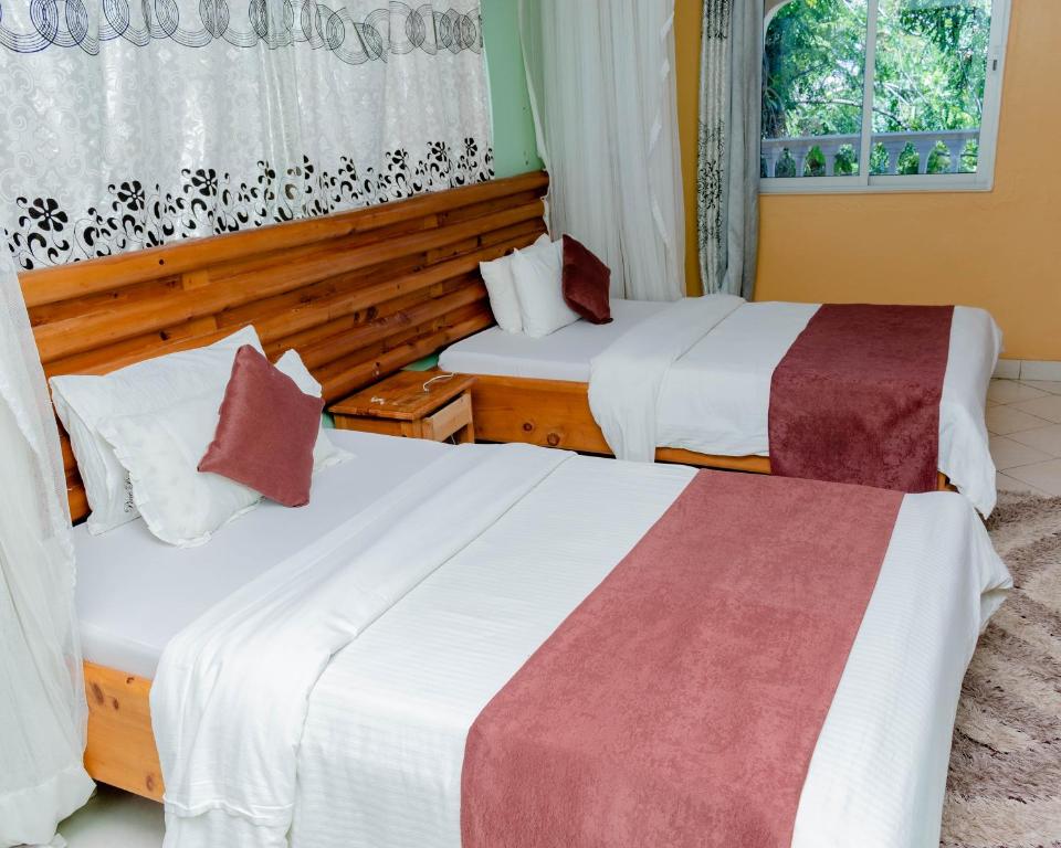 Postel nebo postele na pokoji v ubytování Pinebreeze Holiday Resort