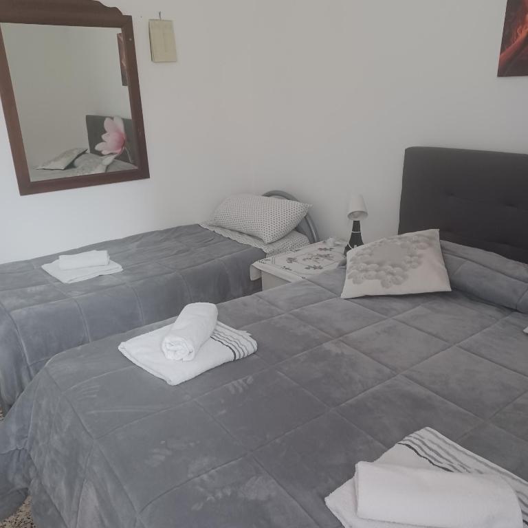 Posteľ alebo postele v izbe v ubytovaní B&B Appartamenti NAPOLI