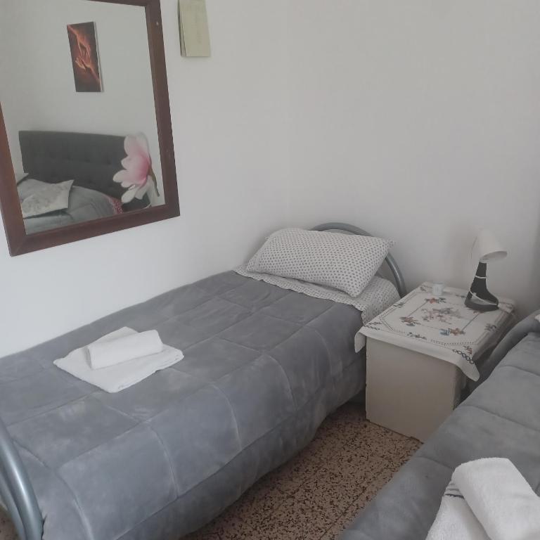Posteľ alebo postele v izbe v ubytovaní B&B Appartamenti NAPOLI