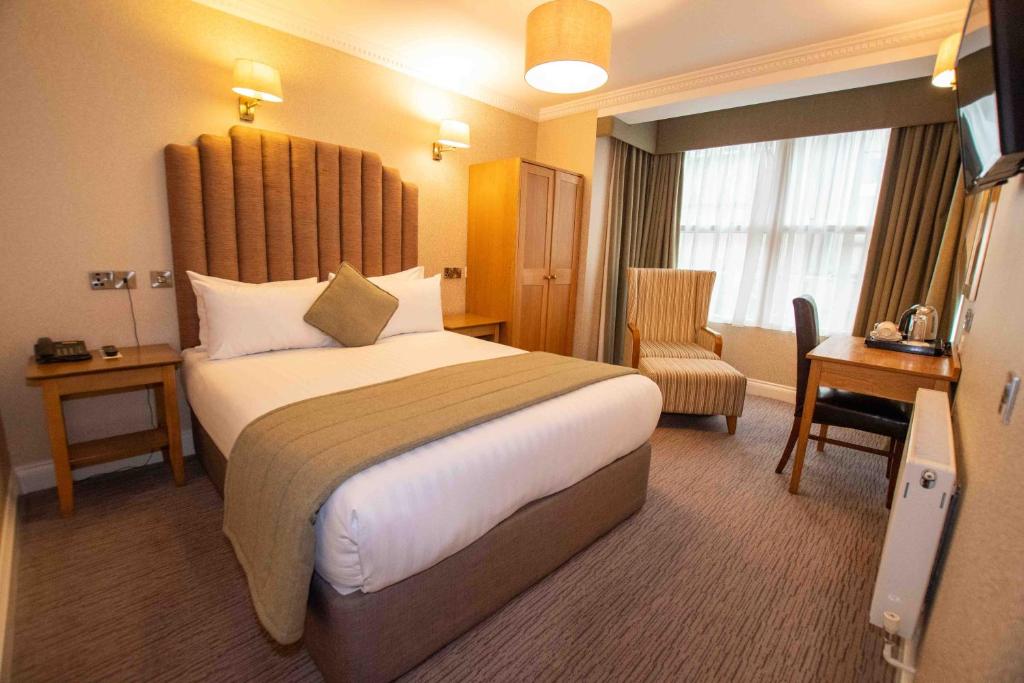 Postel nebo postele na pokoji v ubytování Castle Hotel