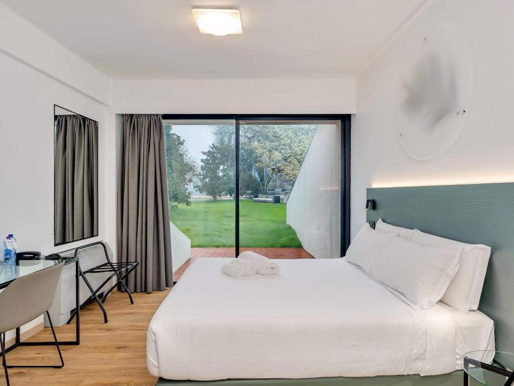 Postel nebo postele na pokoji v ubytování B&B HOTEL Alba