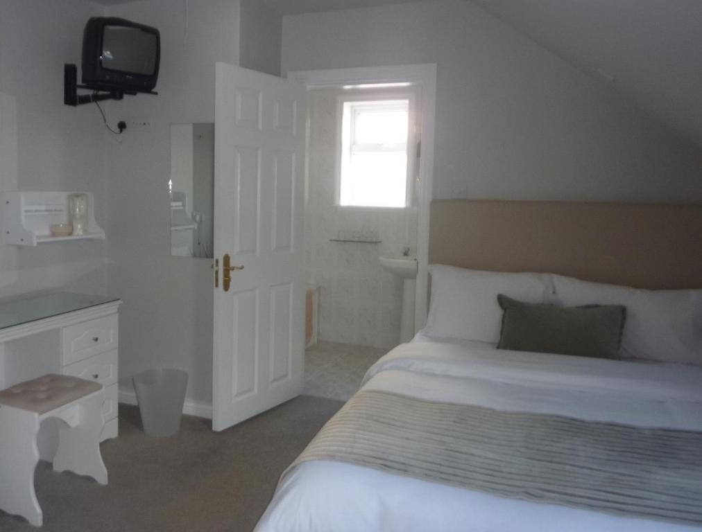 Postel nebo postele na pokoji v ubytování Westwinds Guestlodge