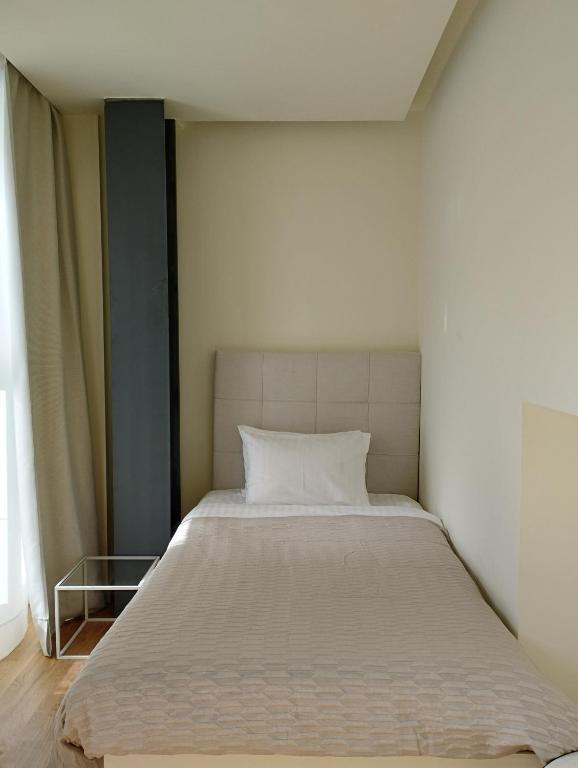 Postel nebo postele na pokoji v ubytování Elite Patras Suites