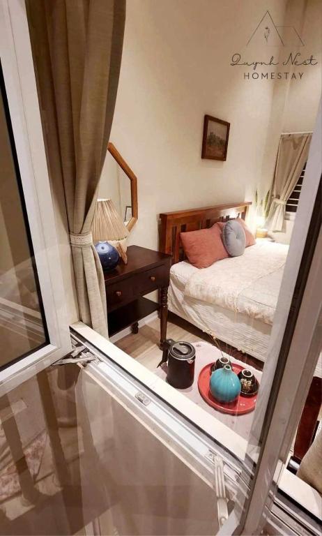 Postel nebo postele na pokoji v ubytování Quynh Nest Homestay