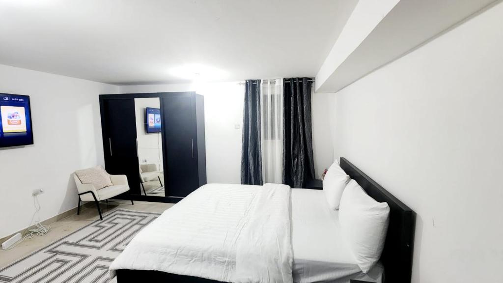 Postel nebo postele na pokoji v ubytování harmony property