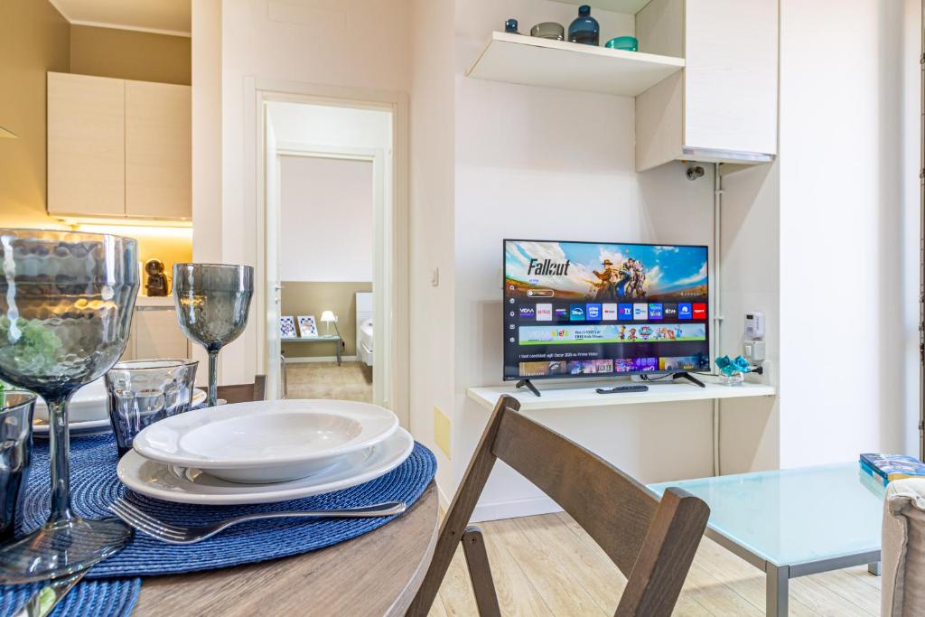 TV a/nebo společenská místnost v ubytování Il quadrato blu