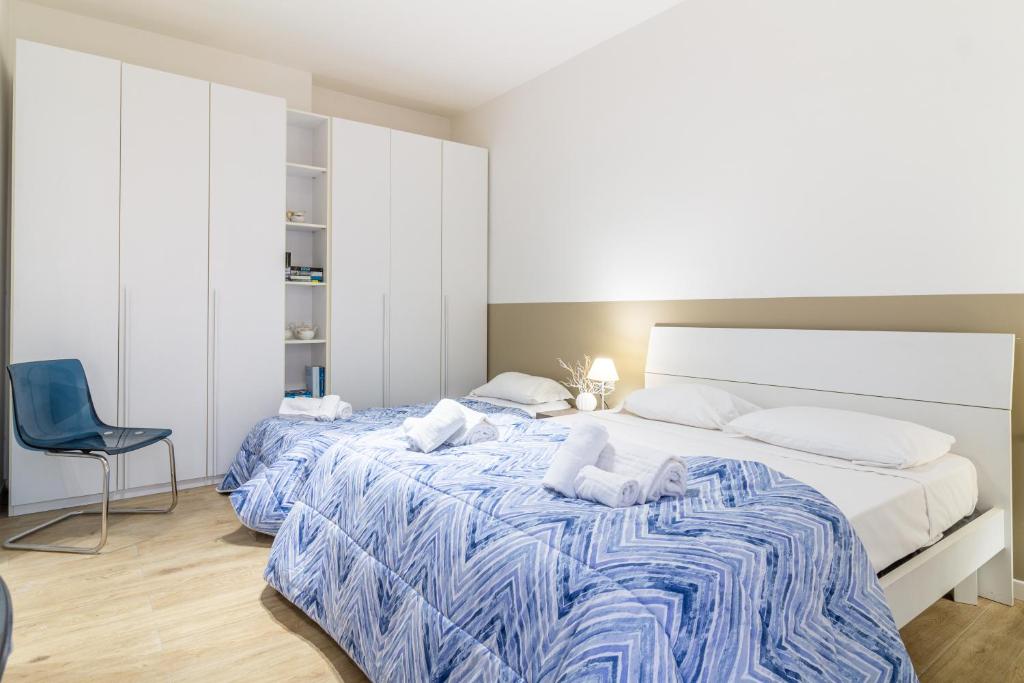 Postel nebo postele na pokoji v ubytování Il quadrato blu