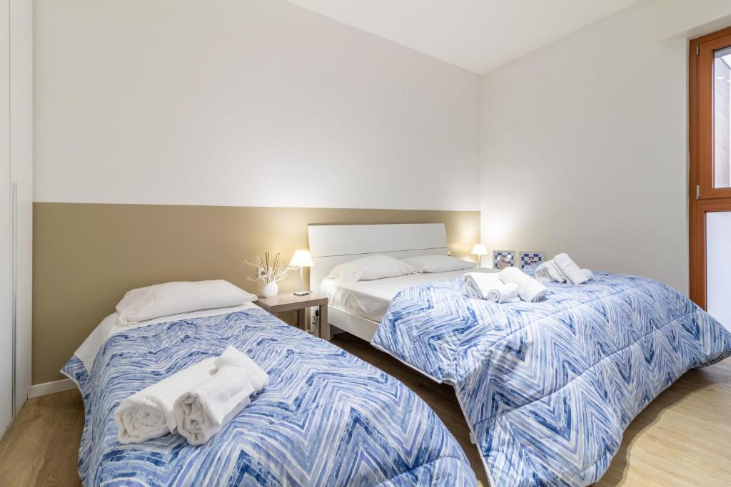 Postel nebo postele na pokoji v ubytování Il quadrato blu