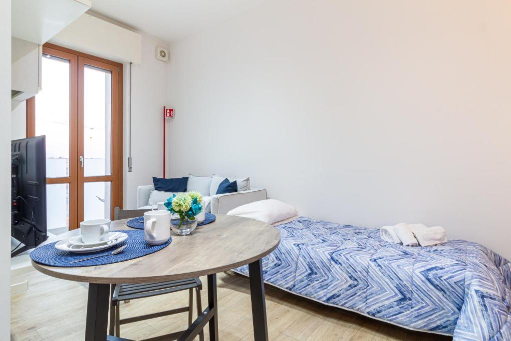 Postel nebo postele na pokoji v ubytování Il quadrato blu