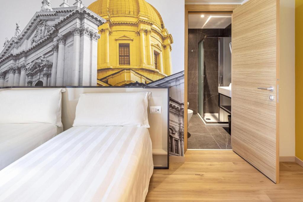 Postel nebo postele na pokoji v ubytování B&B Hotel Brescia