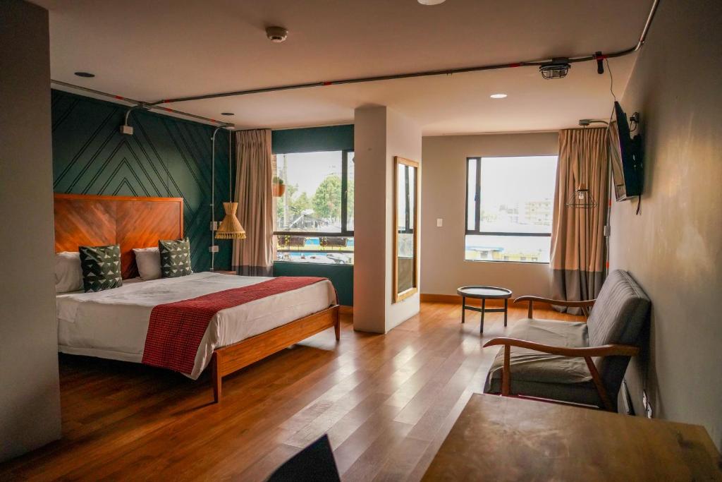 Una cama o camas en una habitación de Hotel Ilar 74