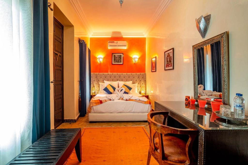 Postel nebo postele na pokoji v ubytování Riad Kamal Deluxe