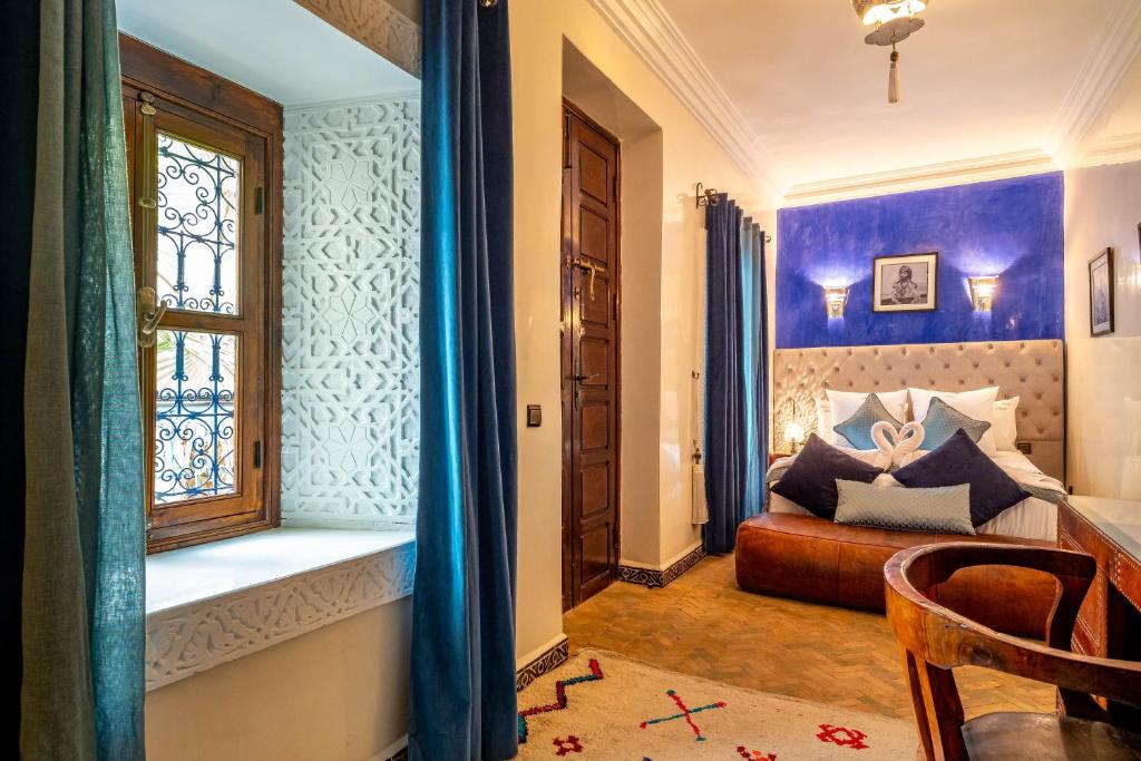 Postel nebo postele na pokoji v ubytování Riad Kamal Deluxe