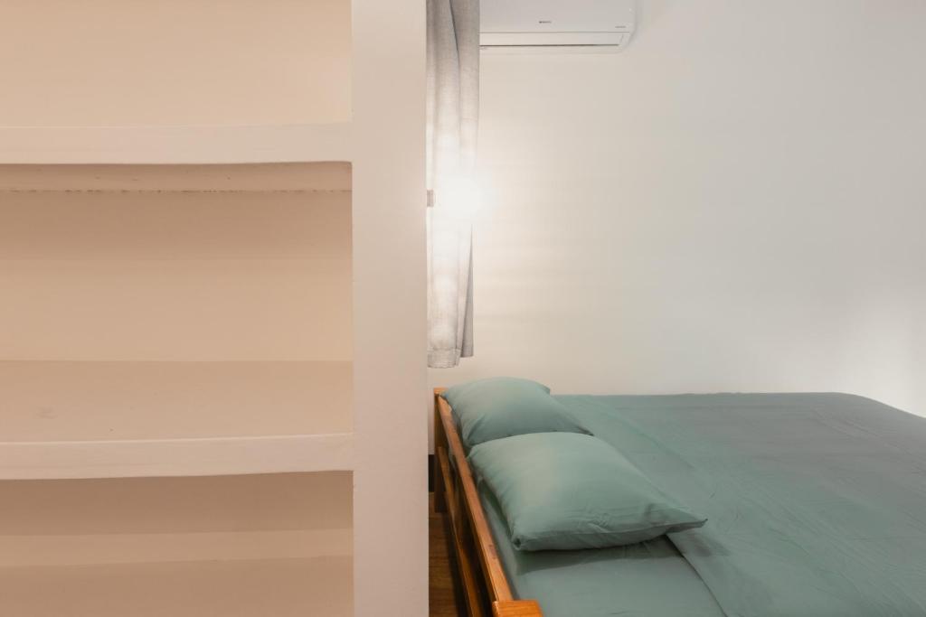 Postel nebo postele na pokoji v ubytování Susi's Suites