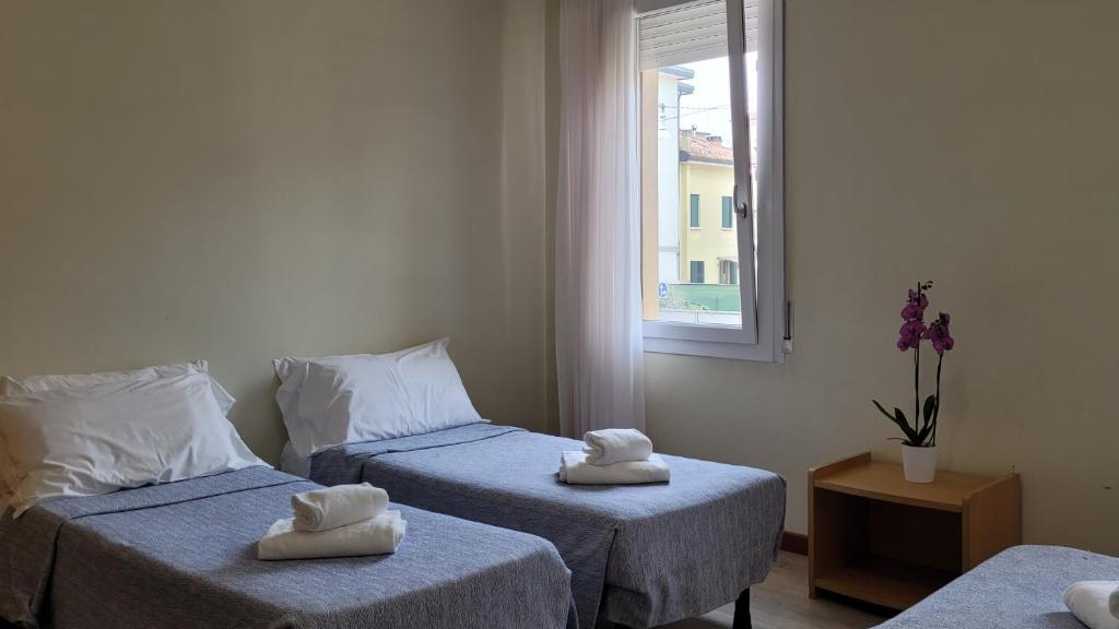 Postel nebo postele na pokoji v ubytování Hotel Montepiana