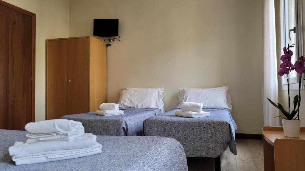 Postel nebo postele na pokoji v ubytování Hotel Montepiana
