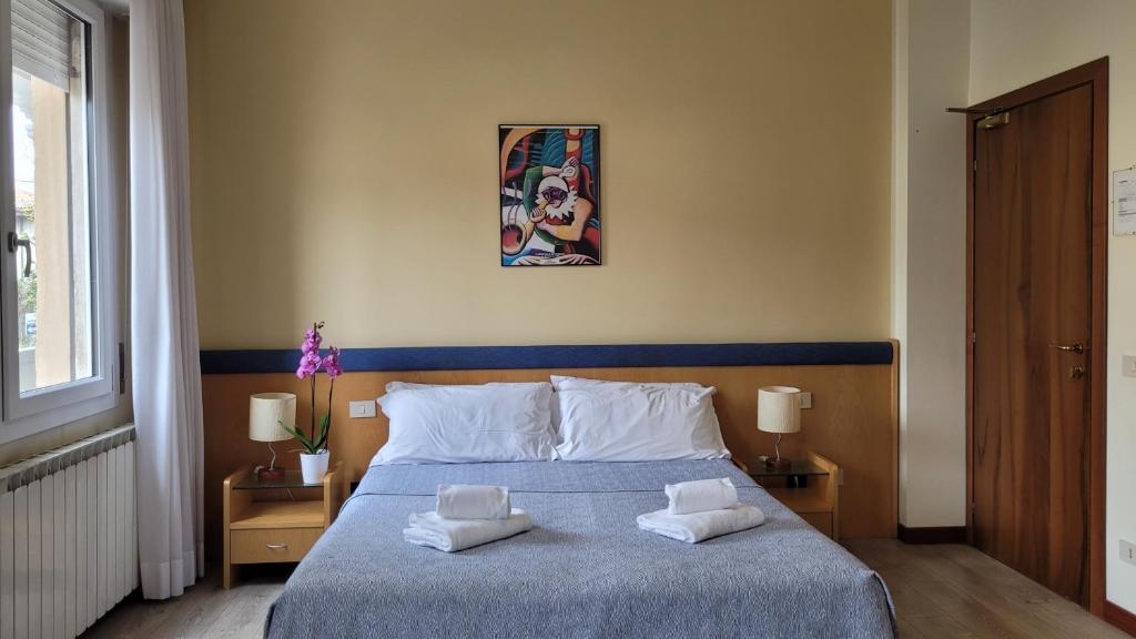 Postel nebo postele na pokoji v ubytování Hotel Montepiana