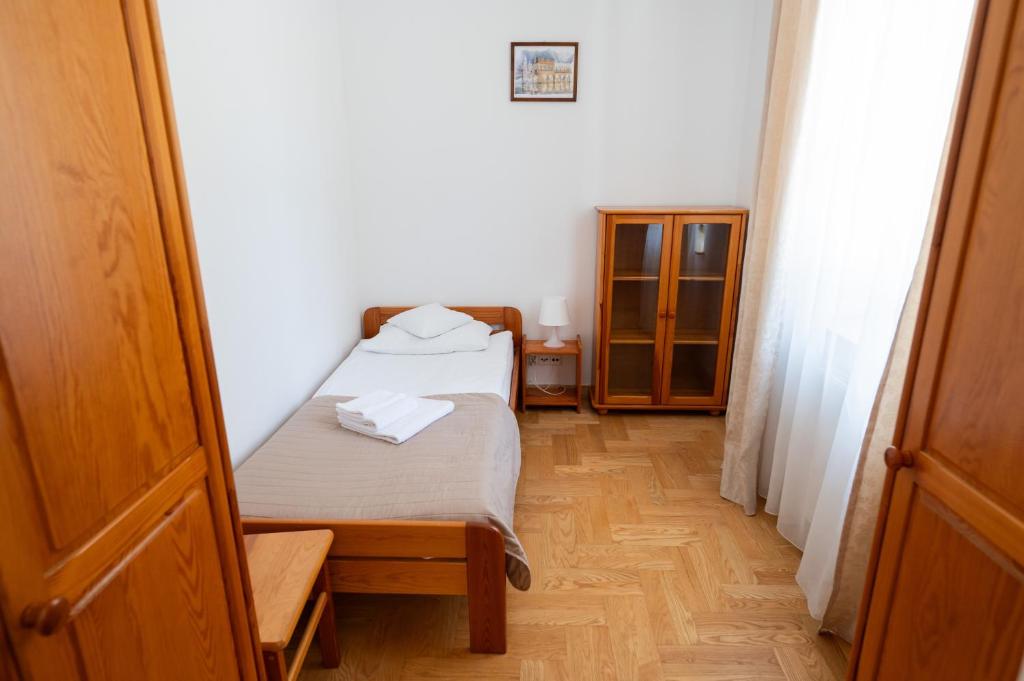 Posteľ alebo postele v izbe v ubytovaní Pokoje Gościnne Dom św. Szymona