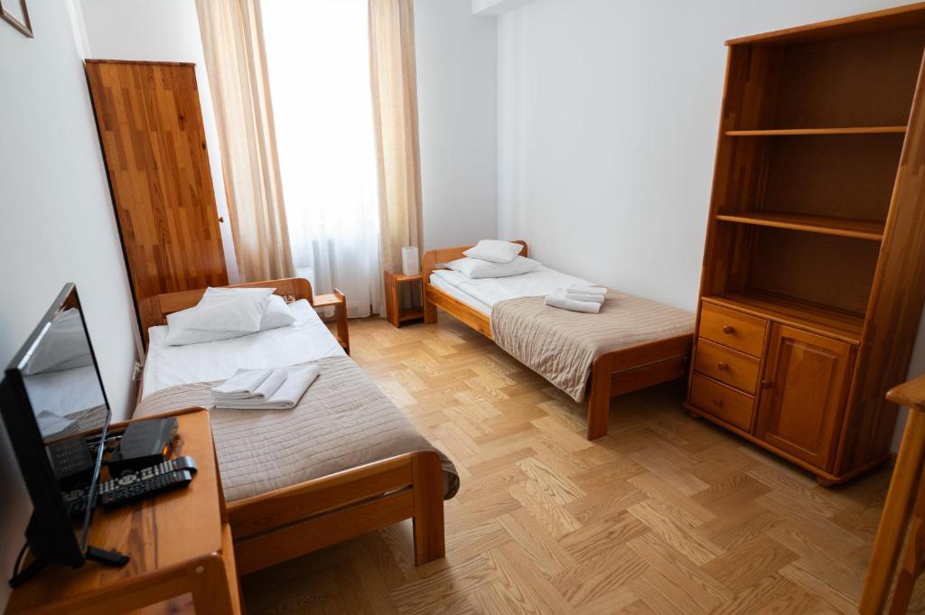 Posteľ alebo postele v izbe v ubytovaní Pokoje Gościnne Dom św. Szymona