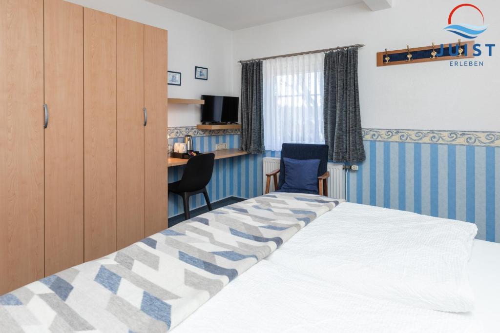 En eller flere senge i et værelse på Töwerland Zimmer 5