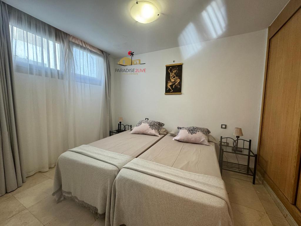 A bed or beds in a room at Atlantida del Sol Corralejo