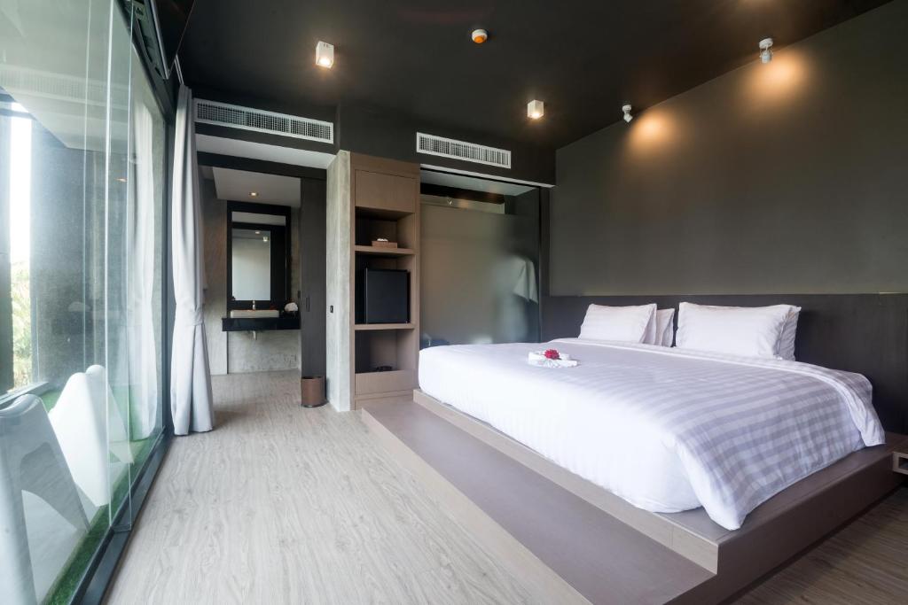 Postel nebo postele na pokoji v ubytování Maya Phuket Airport Hotel-Naiyang Beach