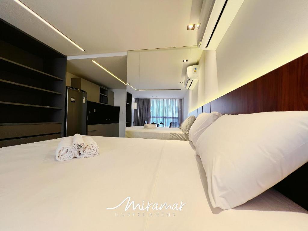 Ein Bett oder Betten in einem Zimmer der Unterkunft Unity - Cabo Branco