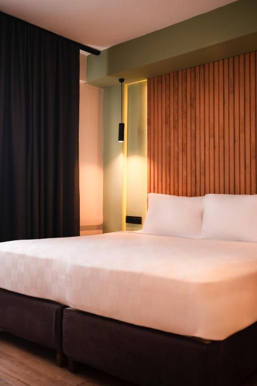 Postel nebo postele na pokoji v ubytování Polek Hotel