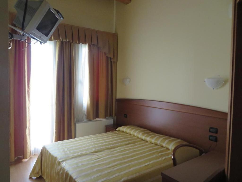 Postel nebo postele na pokoji v ubytování Ristorante Albergo Wada